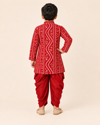 Back view of the boys red bandhani print kurta and draped dhoti set