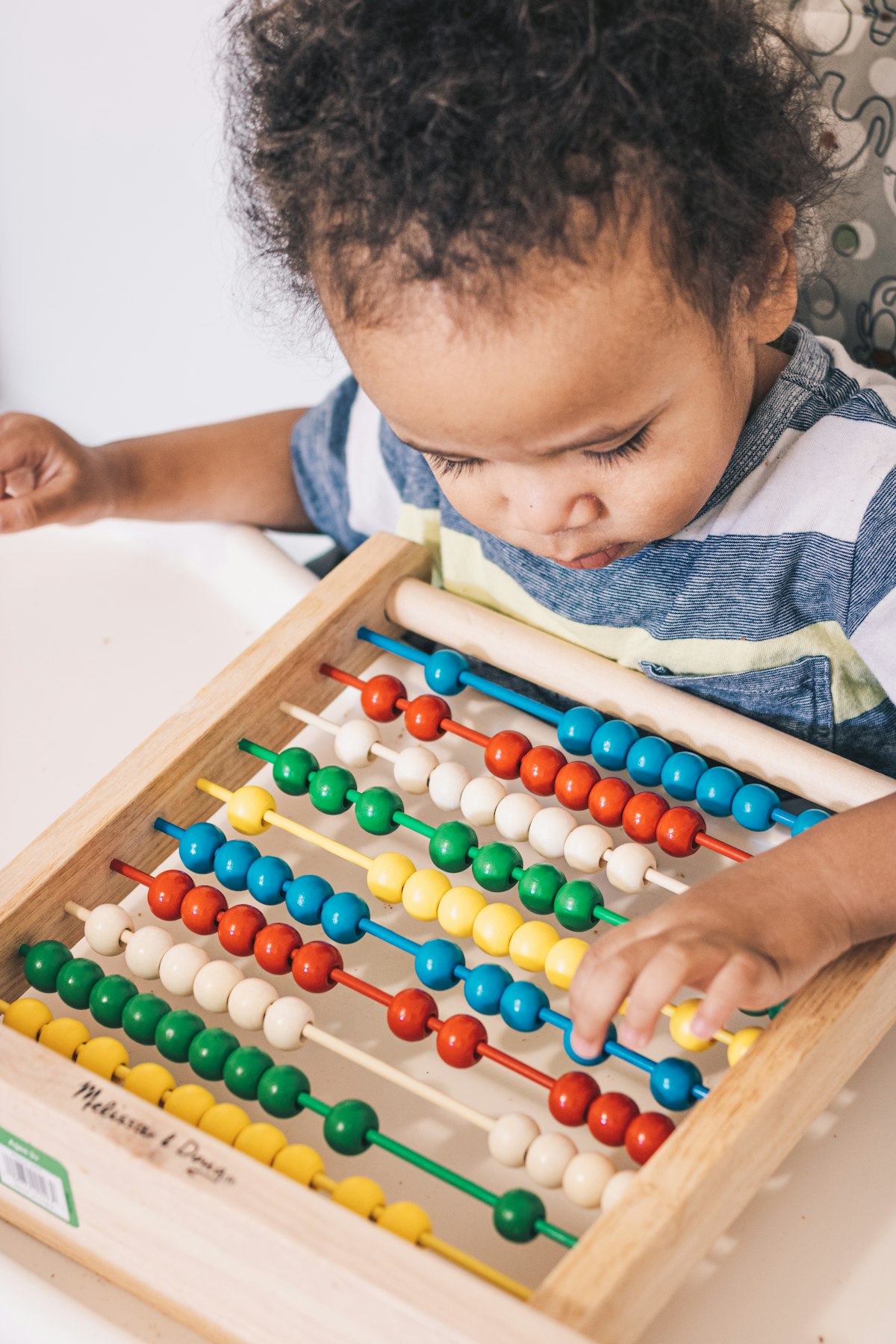 Child engaged with counting and numbers