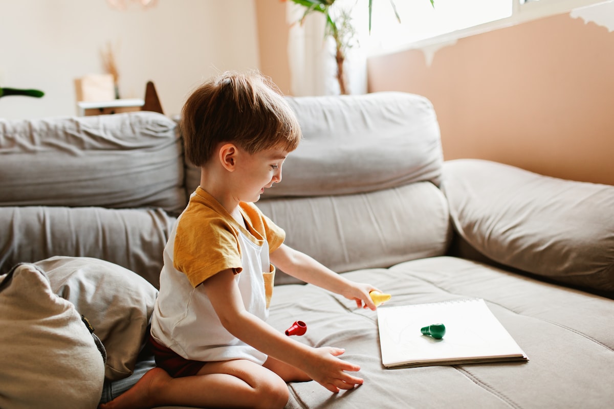 Young child using an educational AR app on a tablet